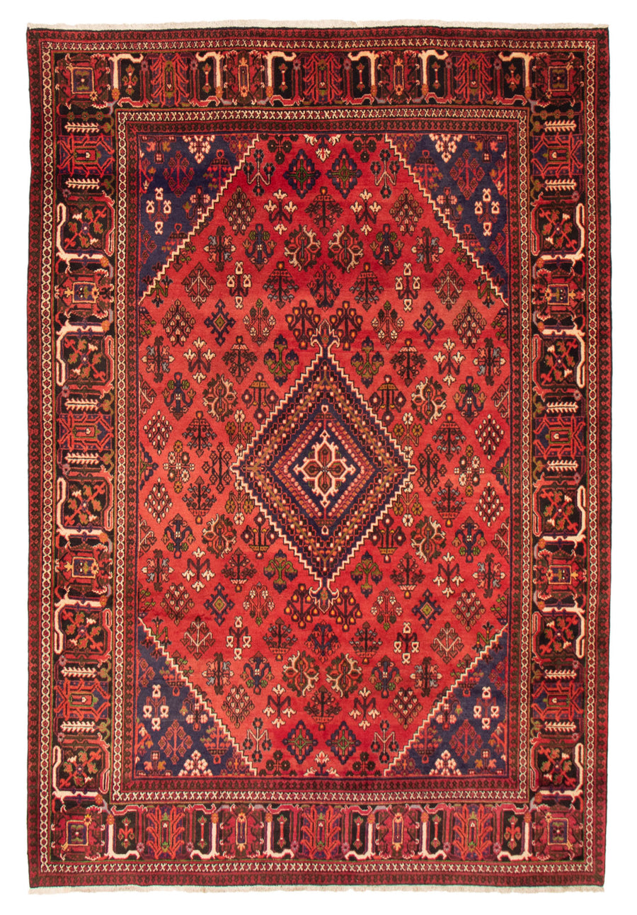 Hand-knotted Persian wool rug in bold geometric patterns, crafted in Iran, available at Tuck Rugs.