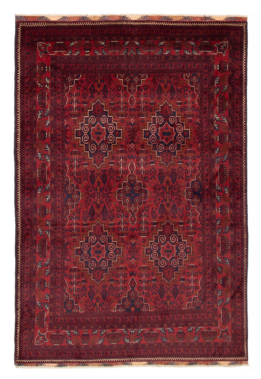 The Rapids hand-knotted Afghan wool rug with bold geometric patterns in red, black, and cream. Available at Tuck Rugs.