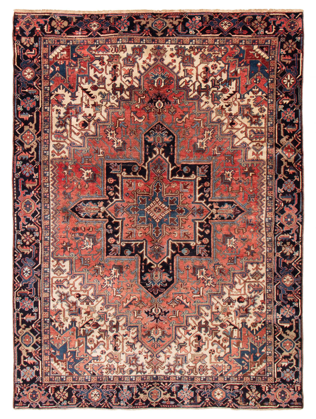 Hand-knotted Turkish wool rug with intricate geometric patterns in soft hues, available at Tuck Rugs.