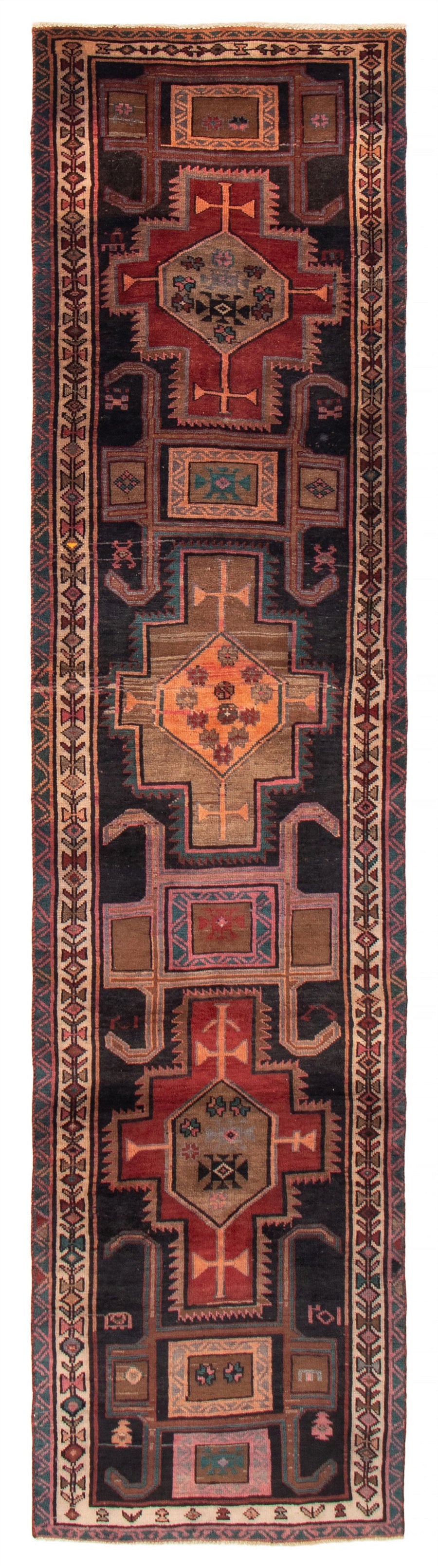 The Leinster Turkish wool runner featuring intricate geometric patterns in dark tones of brown, navy, and red. Available at Tuck Rugs.