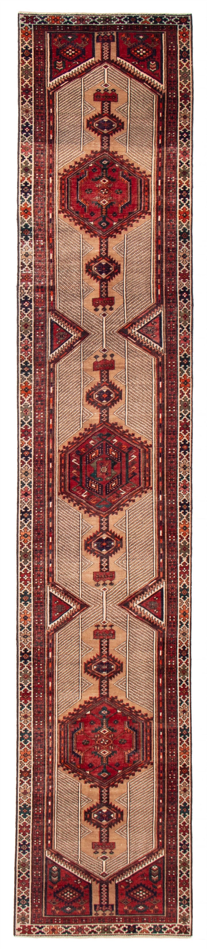 The Port City Turkish wool runner featuring intricate geometric patterns in cream, red, and blue tones. Available at Tuck Rugs.