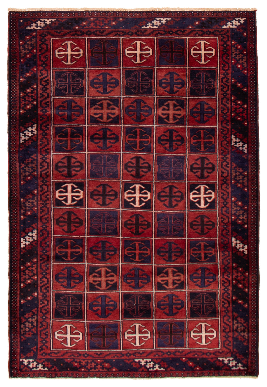 The Harbourview hand-knotted Turkish wool rug featuring a bold geometric pattern in rich reds and blues. Available at Tuck Rugs.