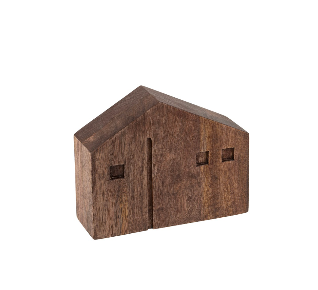 Wooden model of a house on a white background