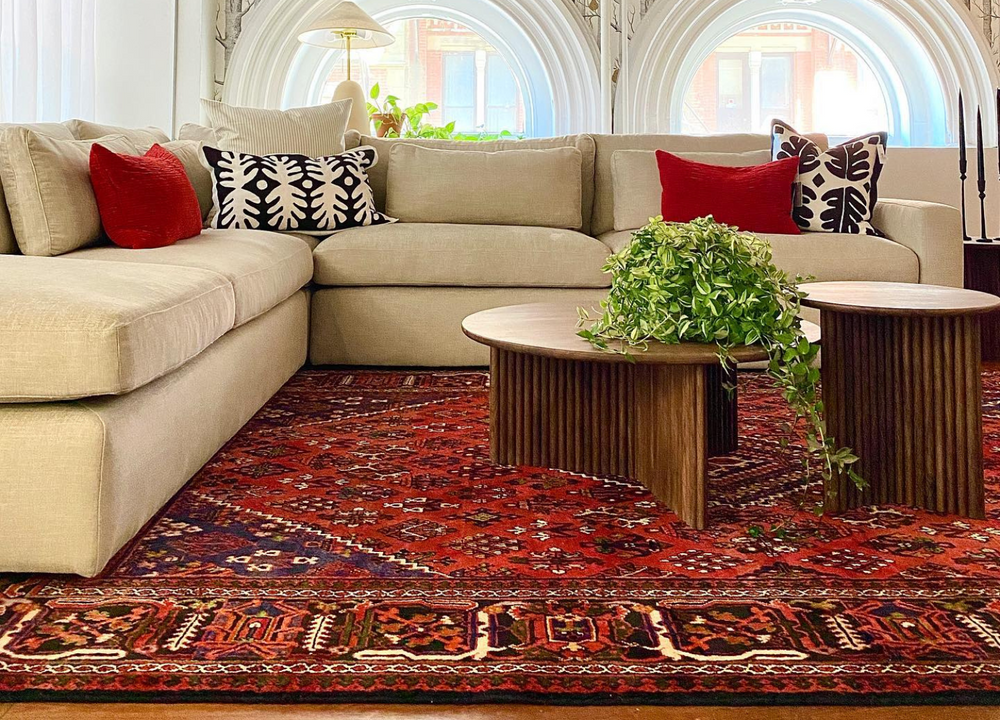 The William rug displayed with rich copper and cream tones, hand-knotted in Iran, available at Tuck Rugs.