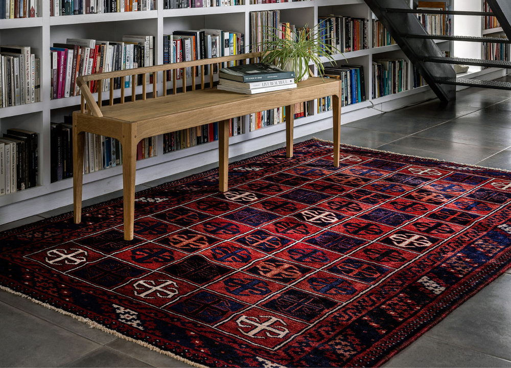 The Harbourview Rug displayed in a cozy library setting, adding warmth with its intricate geometric design. Available at Tuck Rugs.