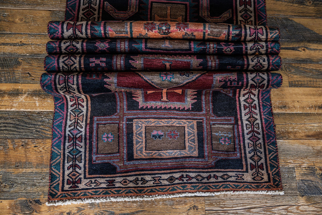 Close-up view of The Leinster Rug’s hand-knotted craftsmanship, highlighting its rich color palette. Available at Tuck Rugs.