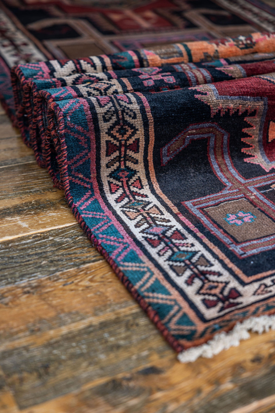 Detailed edge of The Leinster Rug, showcasing fine craftsmanship and bold geometric designs. Available at Tuck Rugs.